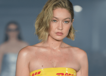 Gigi Hadid’s DHL Tape Strapless Minidress Turns Heads on PFW Runway