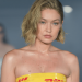 Gigi Hadid’s DHL Tape Strapless Minidress Turns Heads on PFW Runway