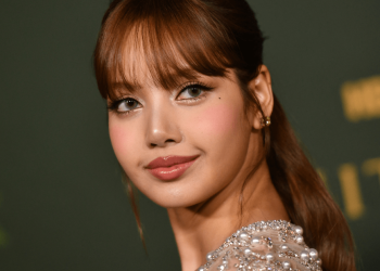 Blackpink’s Lisa Wows in Pink Dress With Dramatic Trail in New Photos