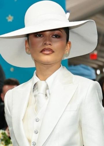 Zendaya Serves Classic Pinstripes With Halter Vest for Louis Vuitton