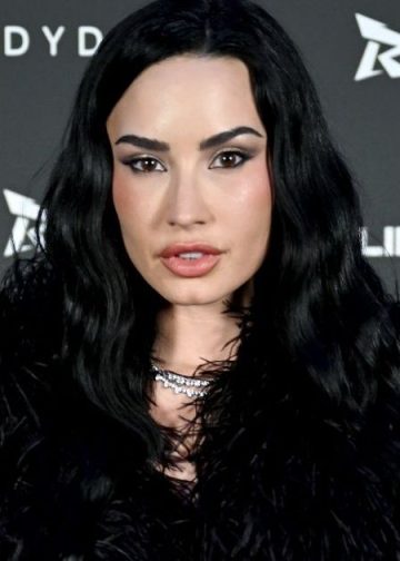 Demi Lovato ‘Warms up for Tour’ in See-Through Lace Corset Bodysuit