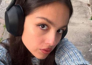 Olivia Rodrigo Layers an Open Jacket Over a Tie-Up Bikini Top for British Vogue