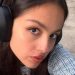 Olivia Rodrigo Layers an Open Jacket Over a Tie-Up Bikini Top for British Vogue