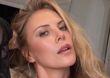 Charlize Theron Uses Her Hand as a Top in Sun-Soaked Photo