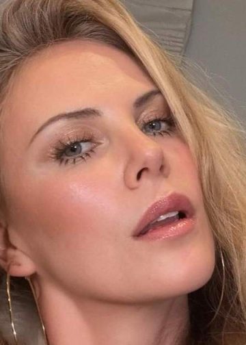 Charlize Theron Uses Her Hand as a Top in Sun-Soaked Photo