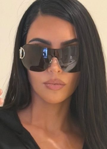 Kim Kardashian Doubles up on Bikinis & Leaves Plenty Exposed